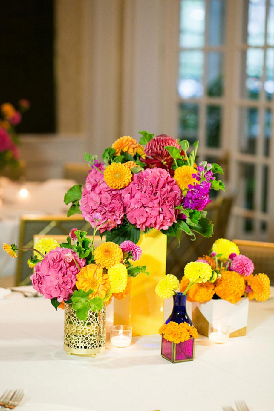 Pink hydrangea, orange and yellow Dahlia wedding centerpiece collection