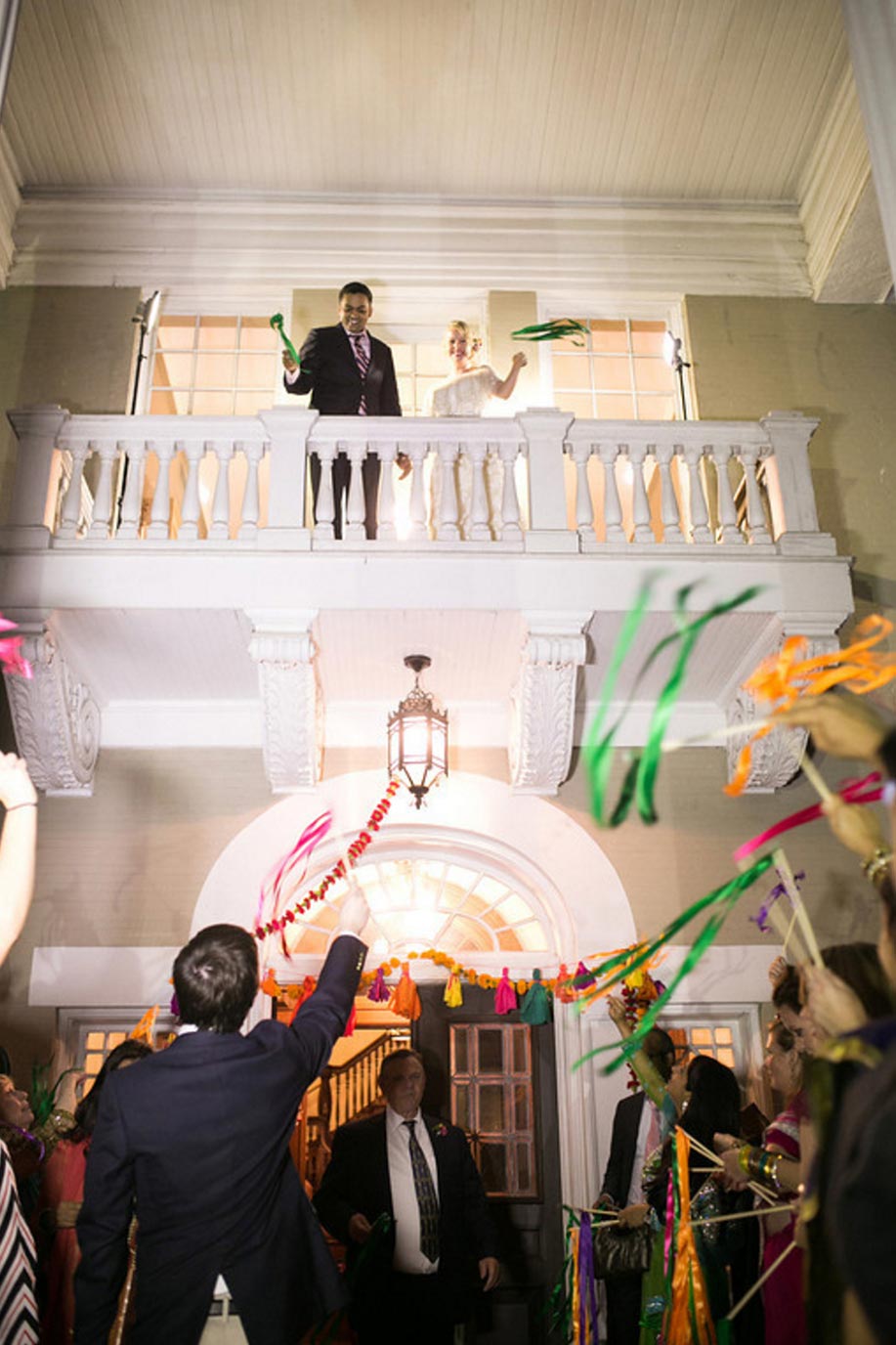 Bride and groom on balcony at Indian wedding at Belo Mansion in Dallas