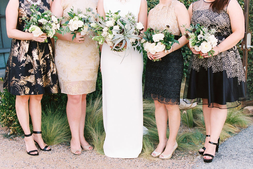 Bridal party in black and gold dresses at The Belmont Hotel