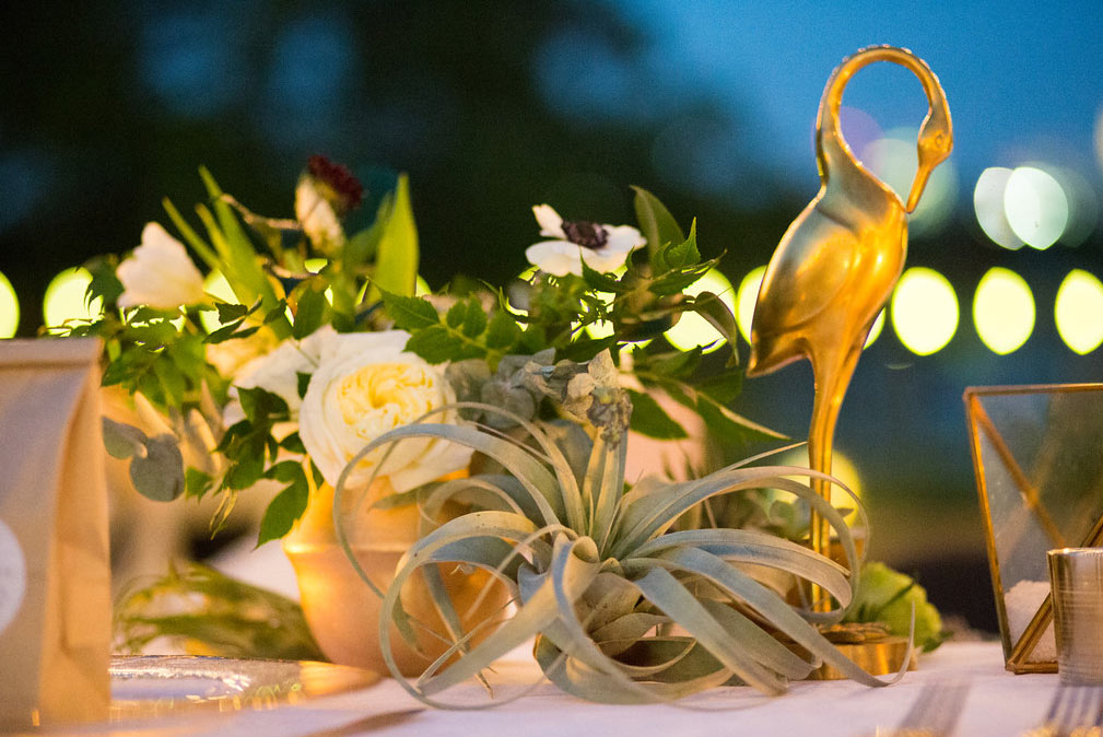 Gold flamingo and candle wedding reception table centerpiece