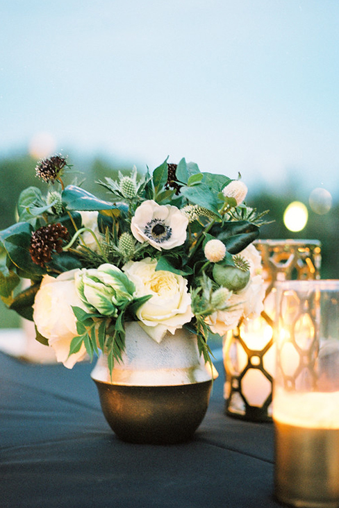 Gold and white wedding reception table centerpiece