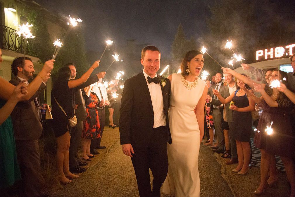 Bride and groom exit with sparklers after wedding reception at The Belmont Hotel in Dallas