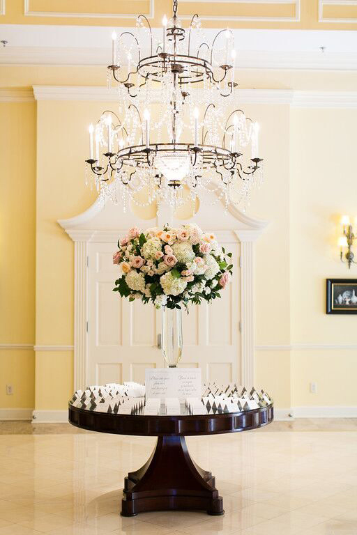 Arlington Hall guest table with wedding centerpiece and escort cards