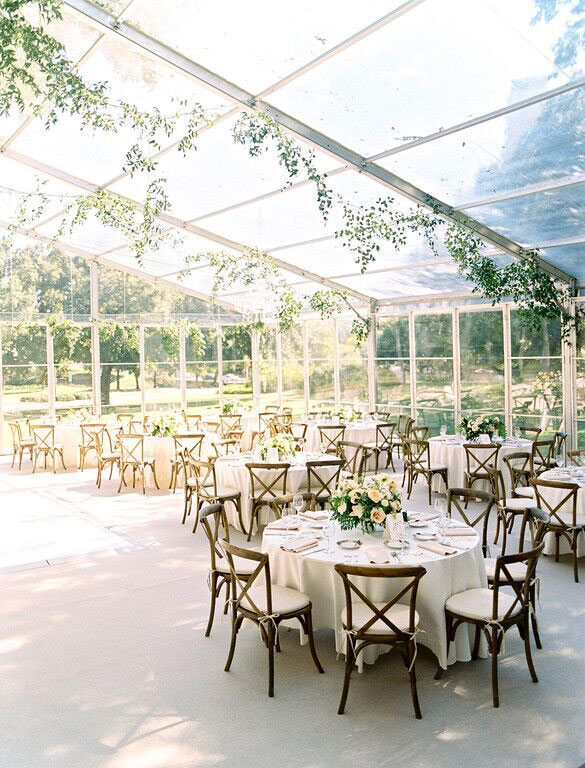 Arlington Hall wedding reception clear tent off back patio with carpeting and cross back chairs