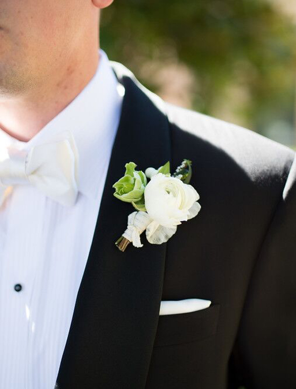 White ranunculus and greenery grooms boutonniere