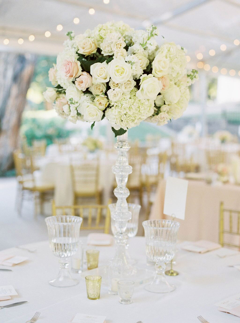 Round tall white and blush wedding reception centerpiece