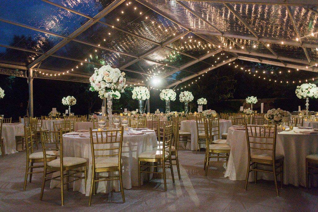 Wedding clear tent at Arlington Hall lower garden with cafe lights