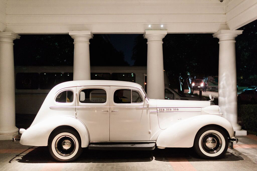 White vintage Bentley wedding getaway car