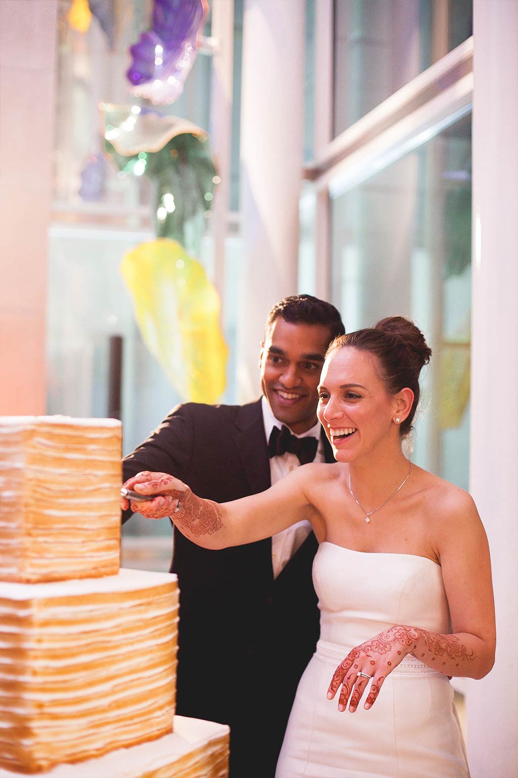 Bride and groom cutting Three Tier Square Wedding Cake by La Duni at Dallas Museum of Art