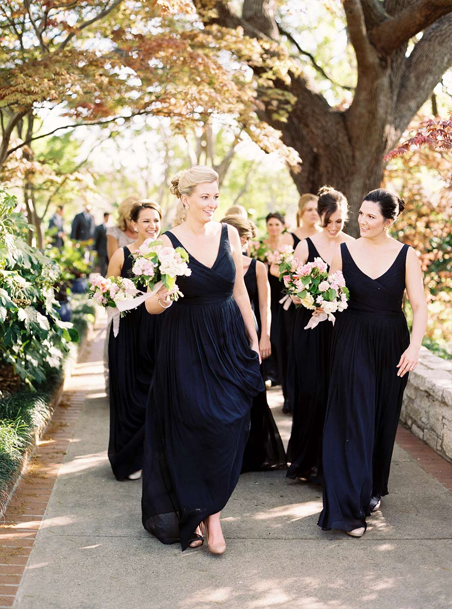 Bridal party in navy long dresses at The Dallas Arboretum