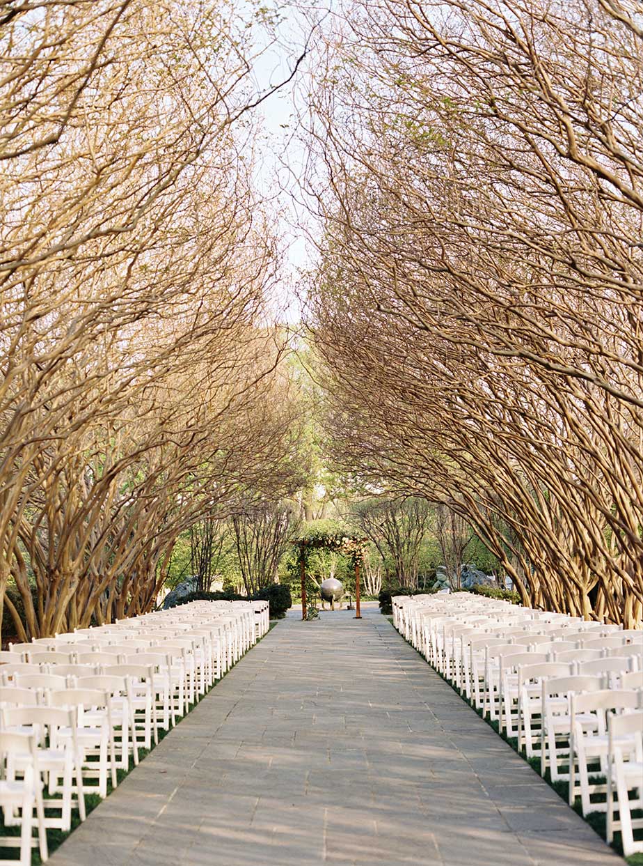 Wedding ceremony setup at Crate Myrtle Allee at The Dallas Arboretum