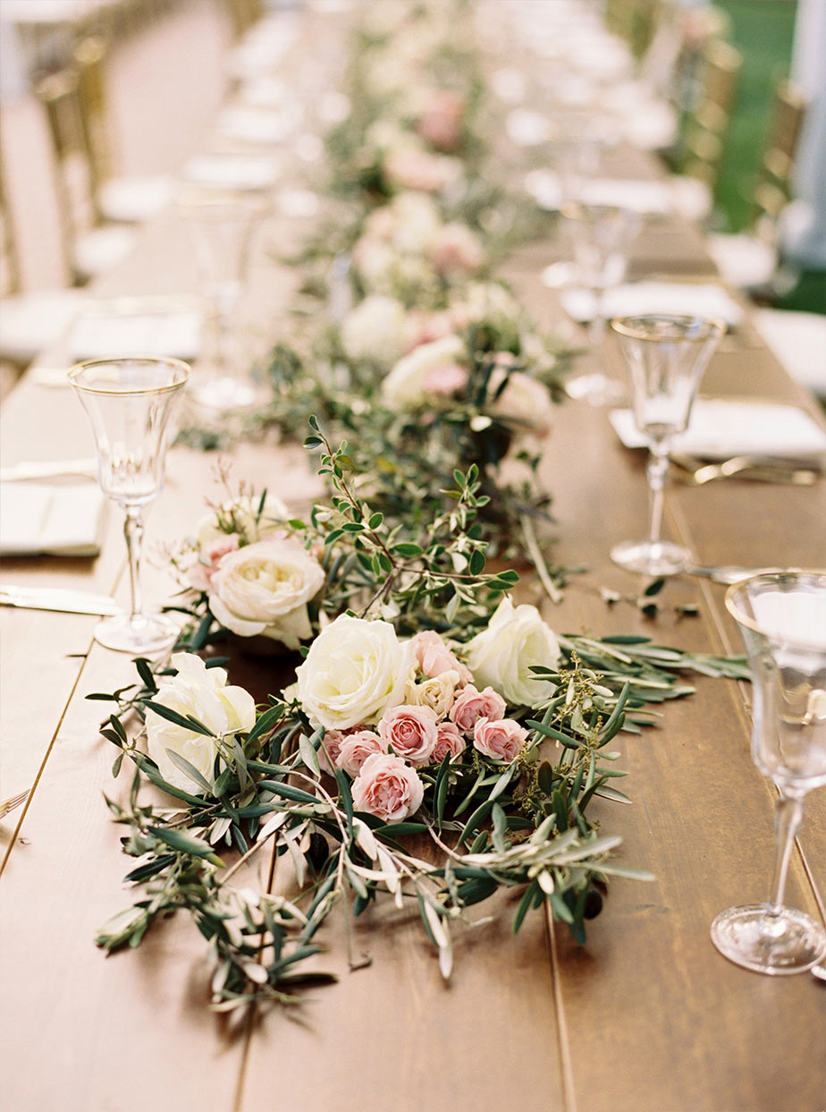 Wooden wedding reception head table floral garland