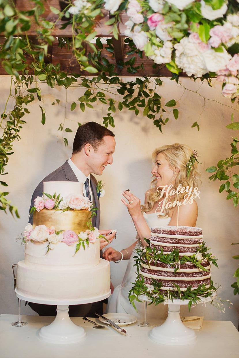 Bride and groom cut their wedding cakes at The Degolyer House at The Dallas Arboretum