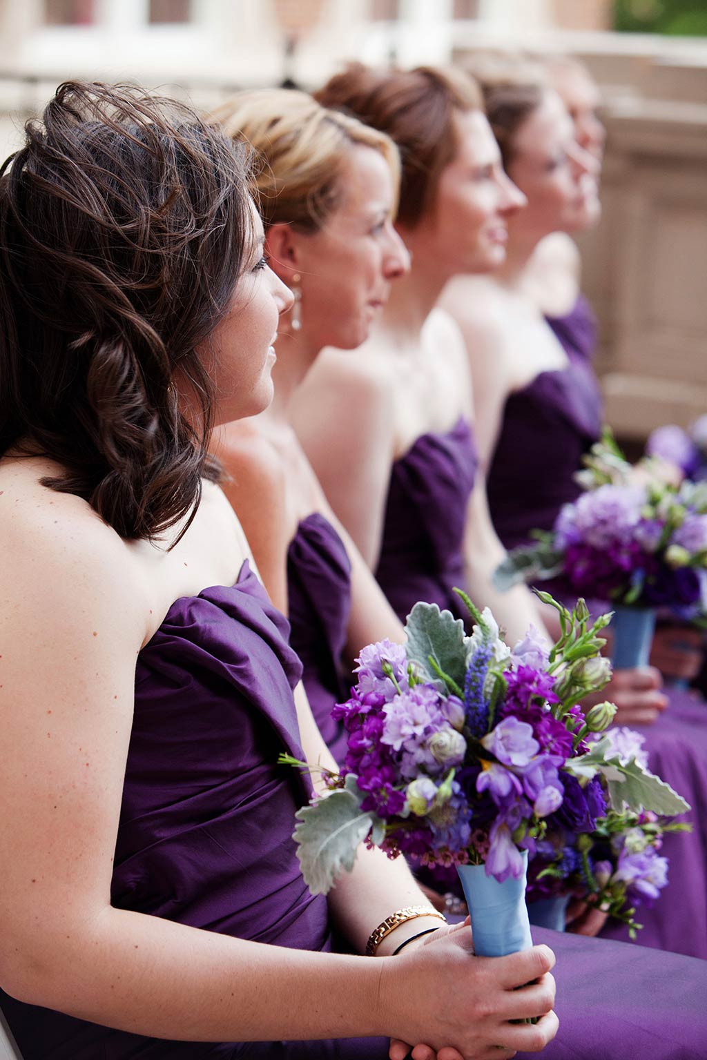 purple bridesmaids dresses and bouquets