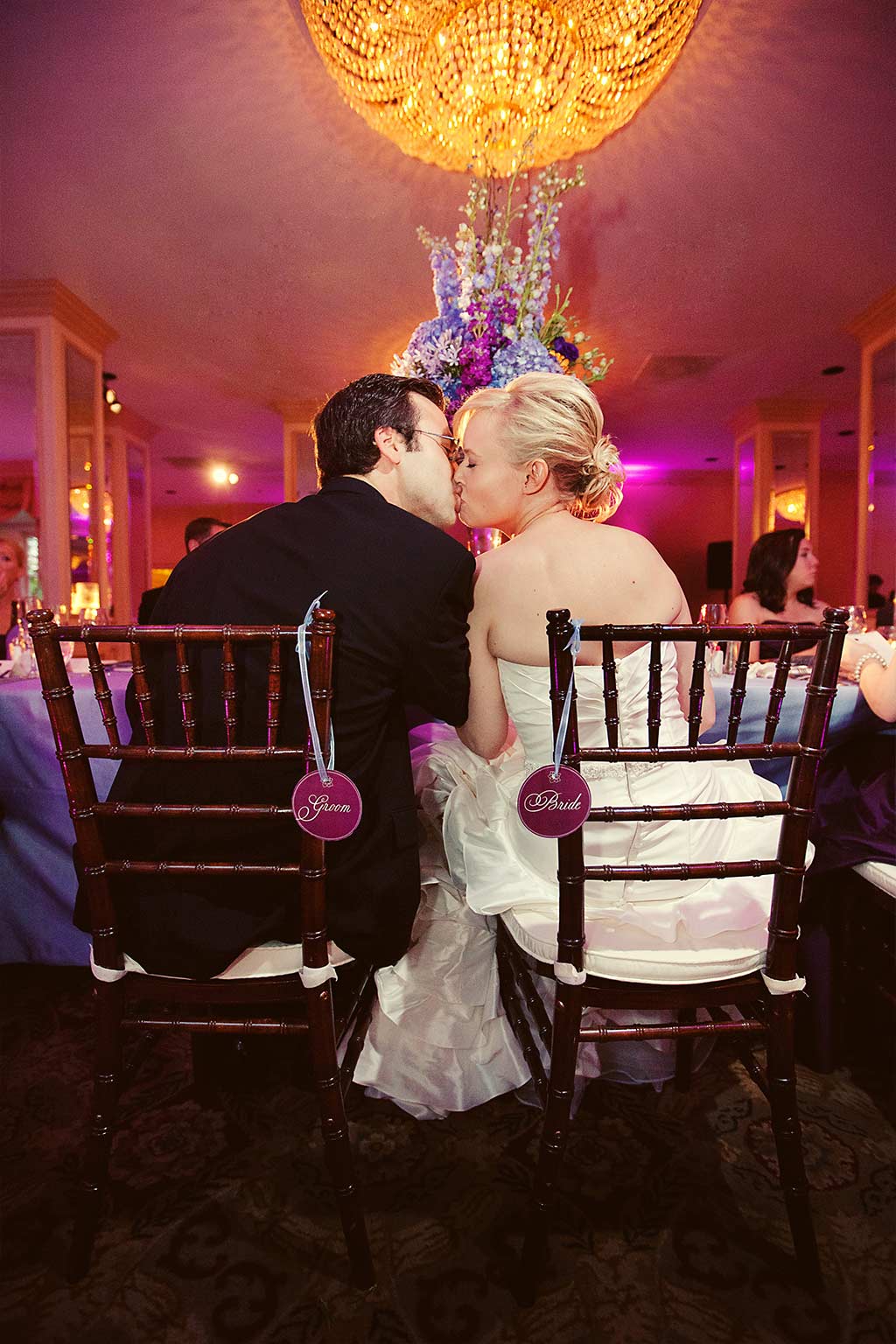 walnut chiavari chairs with bride and groom signs