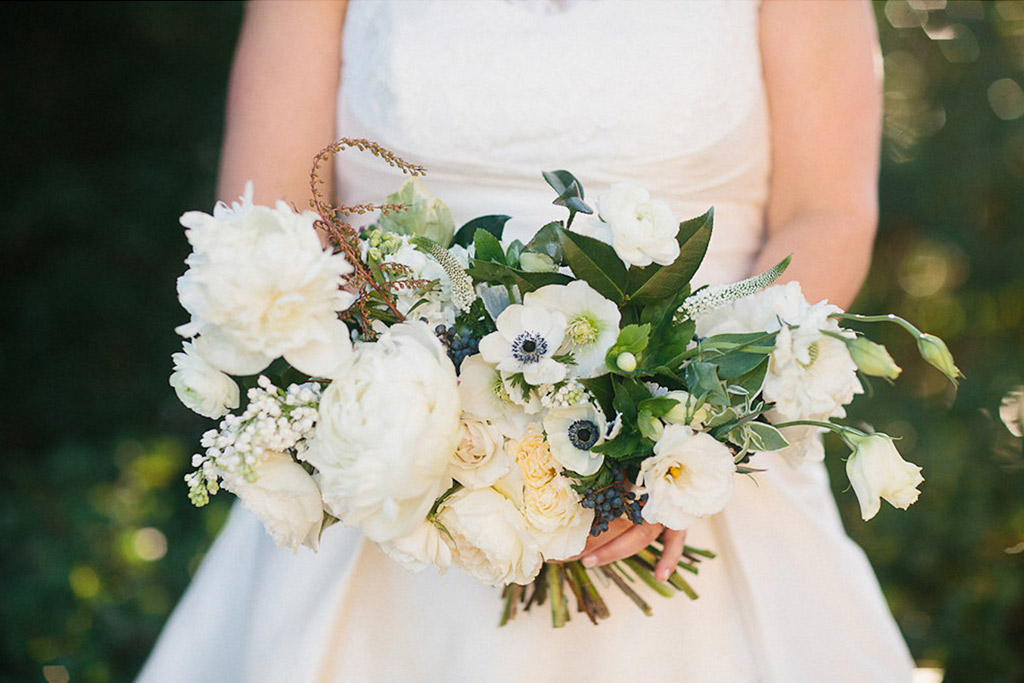 Green and white bridal bouquet with ribbon streamers