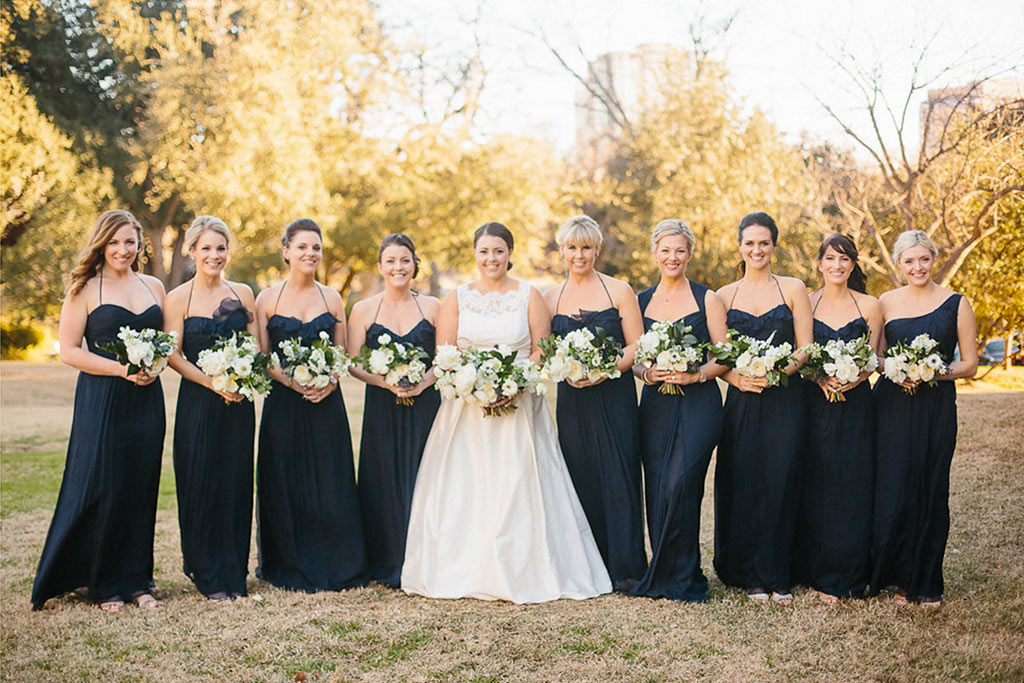 Wedding bridal party outside in long navy dresses