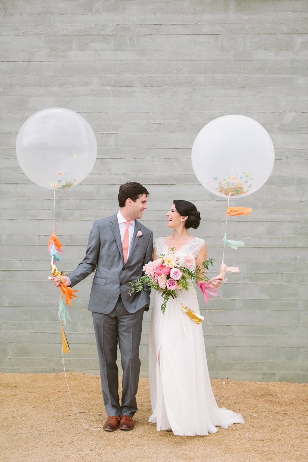 Bride and groom wedding portrait with geronimo balloons