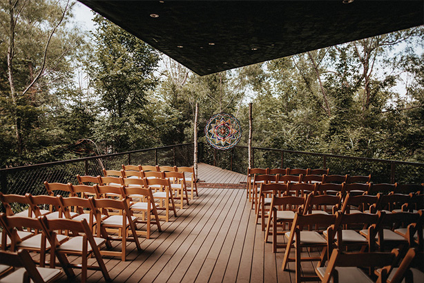 Wedding reception with colorful altar decoration at the Trinity River Audubon Center in Dallas