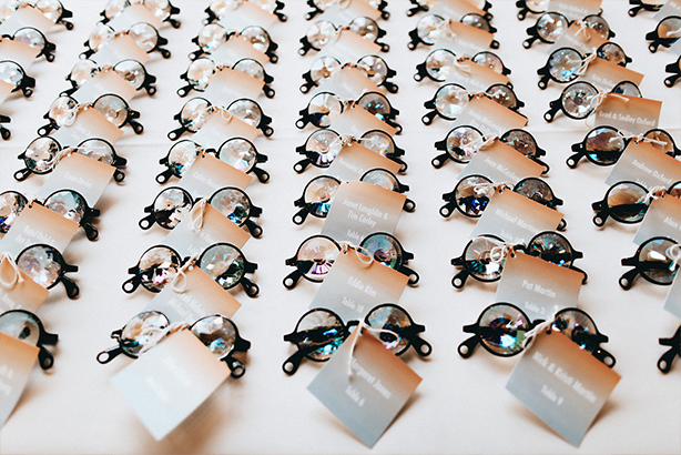 Groovy kaleidoscope glasses used as escort cards and wedding favors