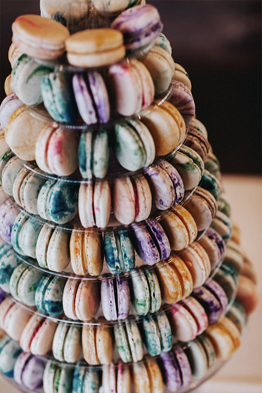 A colorful french macaroon tower at the wedding reception