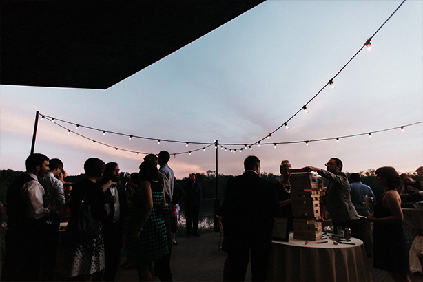 Outdoor cafe lights at a wedding reception at the Trinity River Audubon Center in Dallas