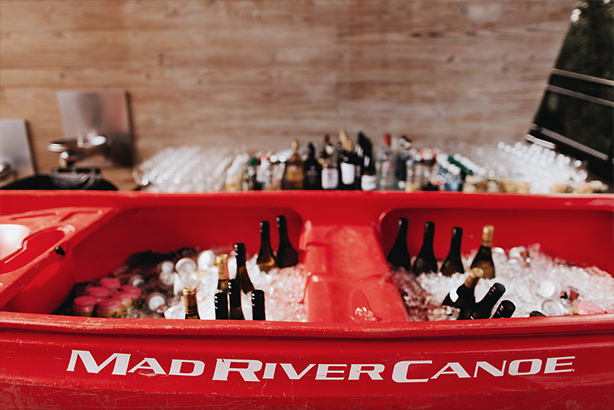 A red Mad River canoe turned into a bar at the wedding reception