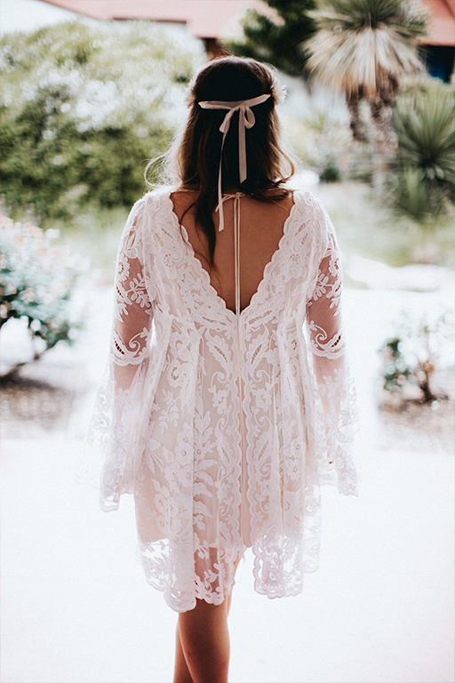 Back of bride's short, belle long sleeve, lace, custom Patti Flowers wedding dress