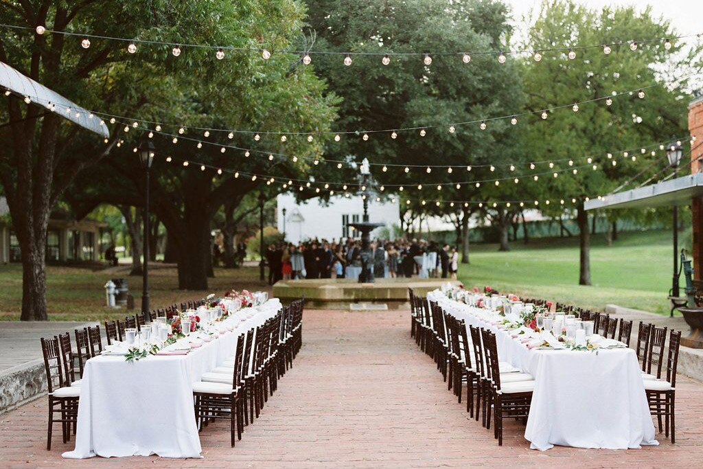 Dallas Heritage Village wedding reception long family tables and cafe lighting