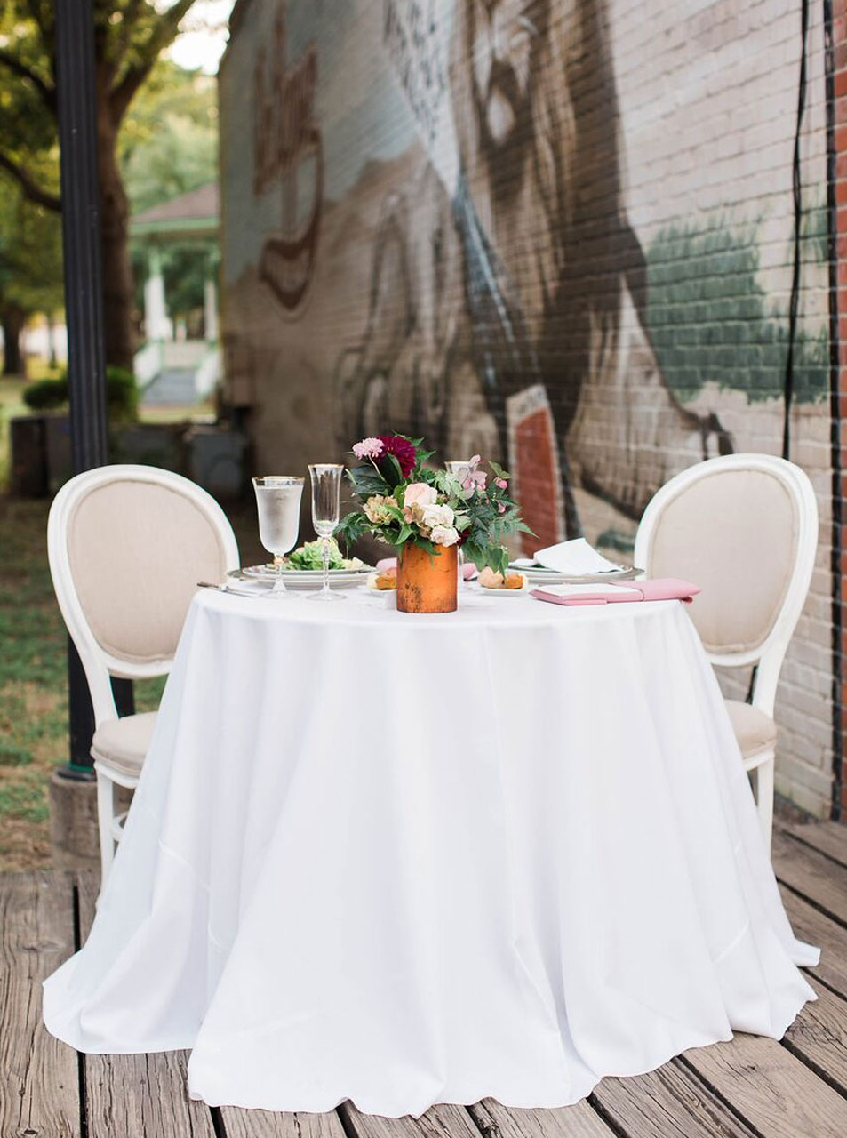 Dallas Heritage Village wedding reception sweetheart table with white round back linen chairs