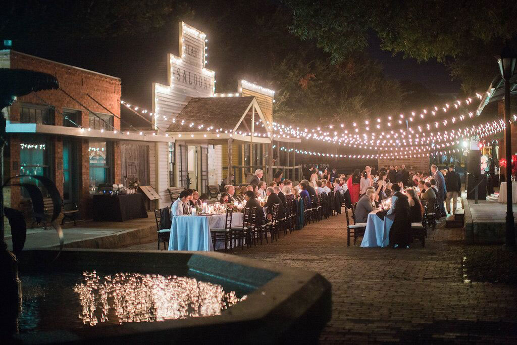 Dallas Heritage Village Wedding reception at night on Main Street with cafe lights