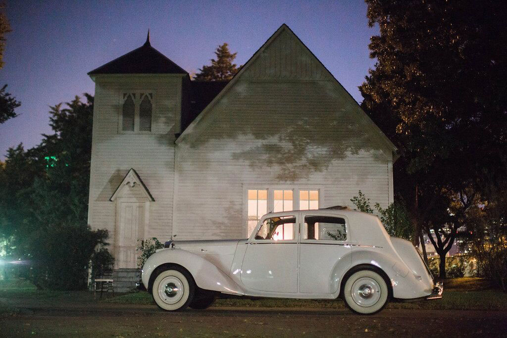 White vintage classic car at Dallas wedding reception