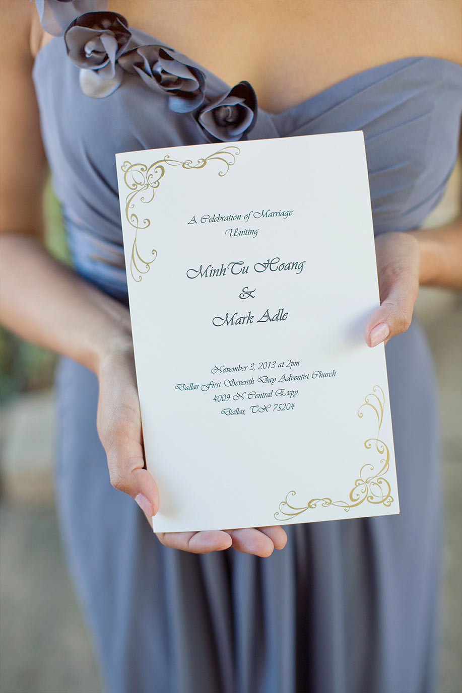 Bridesmaid holding a wedding invitation