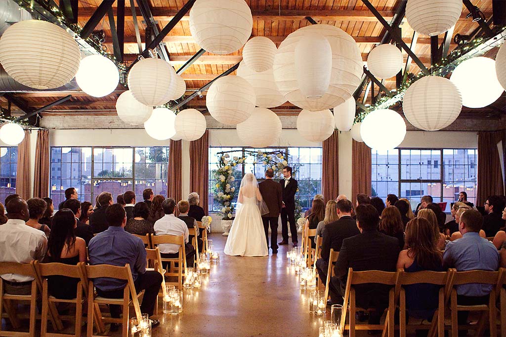industrial loft wedding ceremony with lanterns at Hickory Street Annex in Dallas