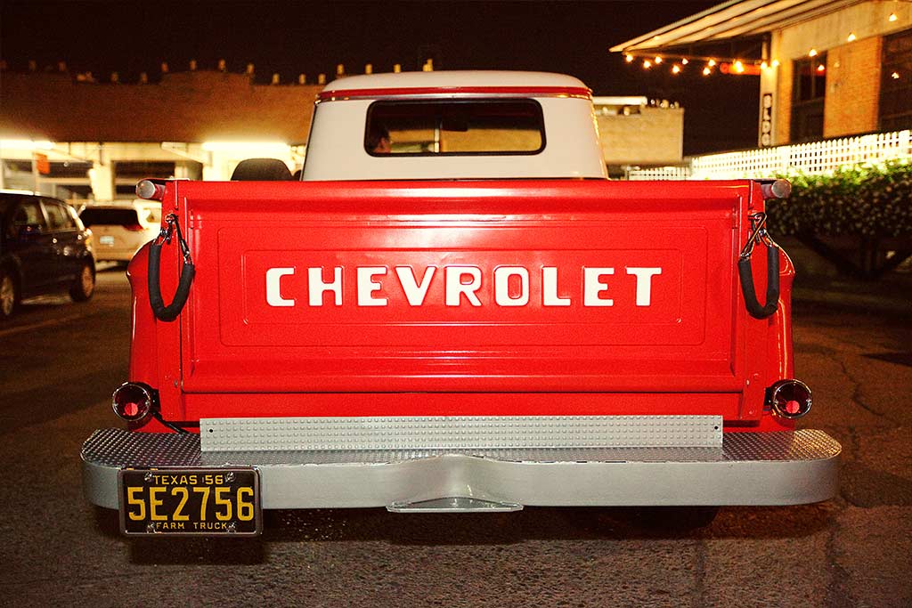 vintage red chevy pickup wedding get away car