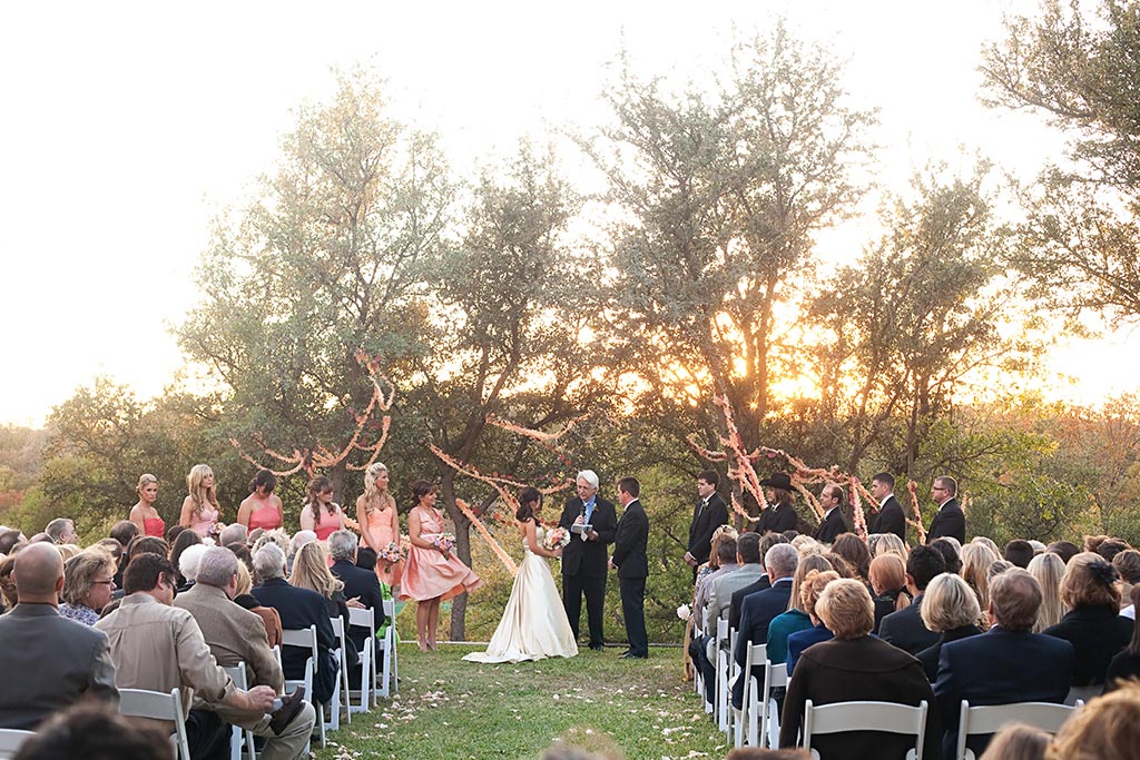 sunset farm wedding ceremony with BHLDN streamers