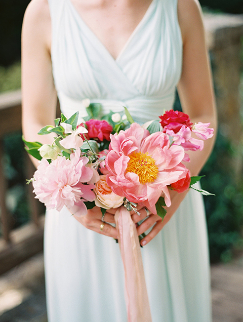 Pink and peach wedding bridesmaid bouquet with ribbon streamer