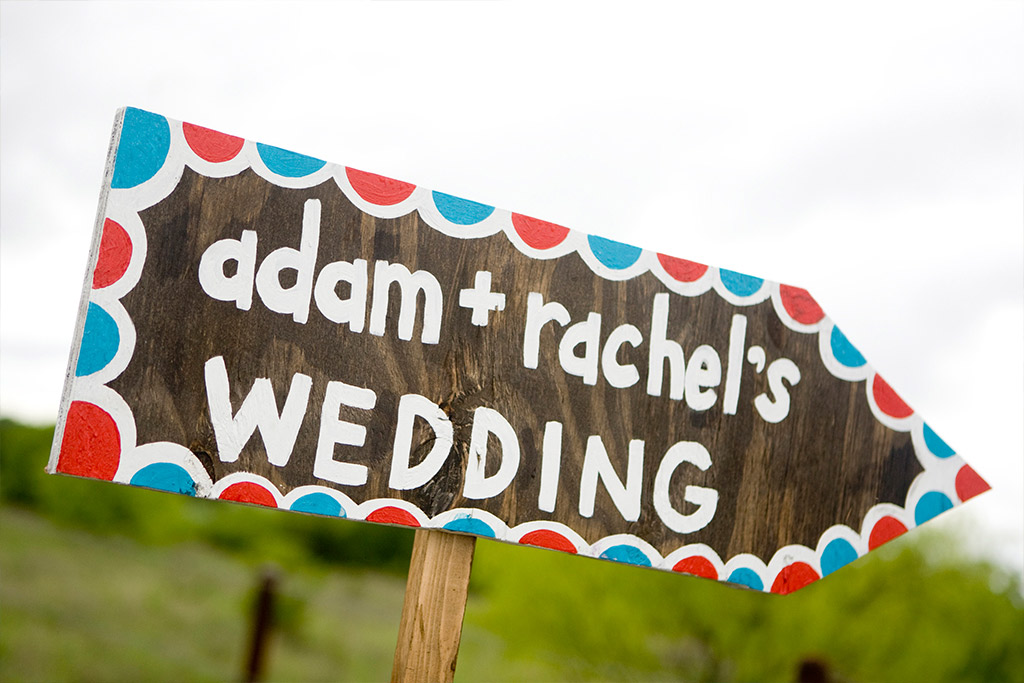 Colorful wedding direction signage
