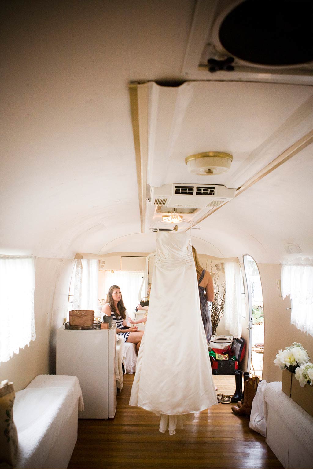 Bride getting ready in airstream trailer at Texas Hill Country wedding ceremony near Austin, Texas