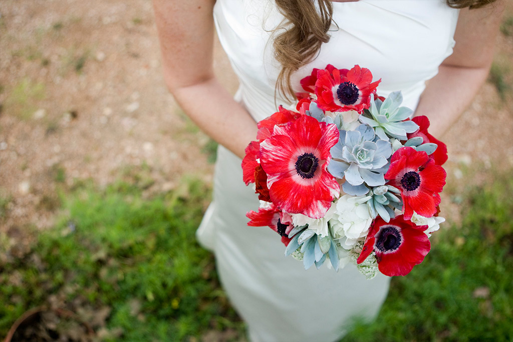 brides bouquet with red poppies and succulents