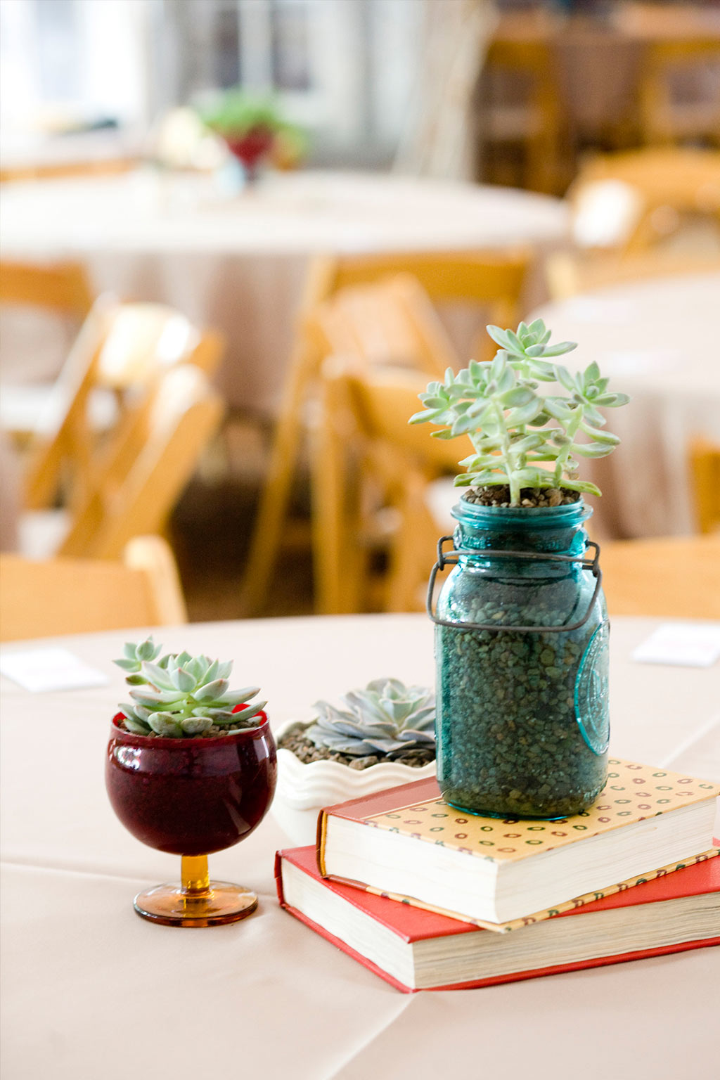 vintage blue mason jar used for wedding reception table centerpiece