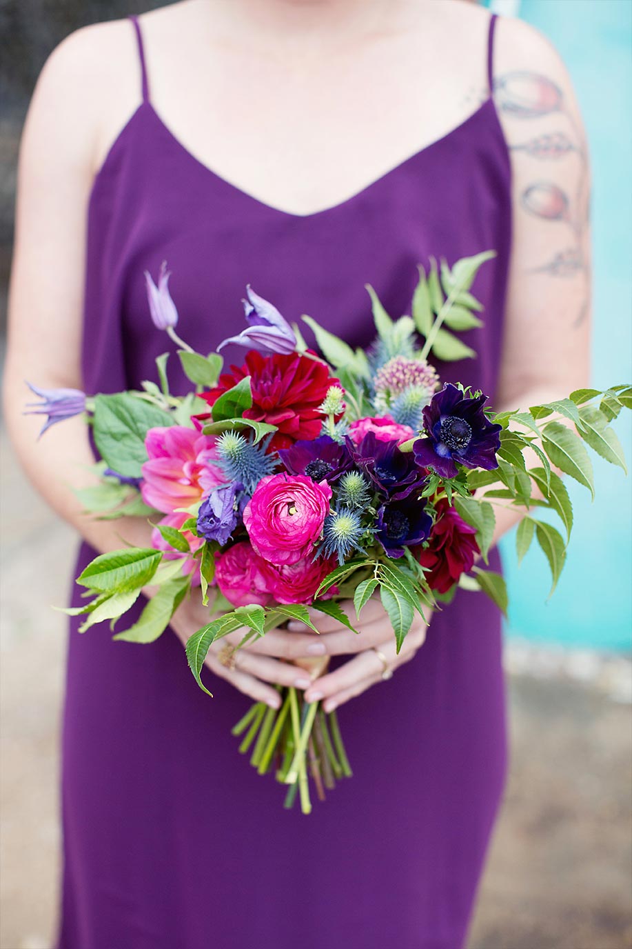 Pink and purple bridesmaid bouquet and purple dress