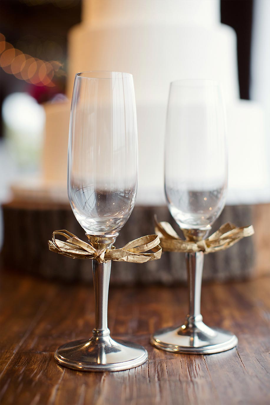 Champagne flutes with gold bows