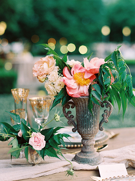 Wedding centerpiece urn and gold-rim glasses